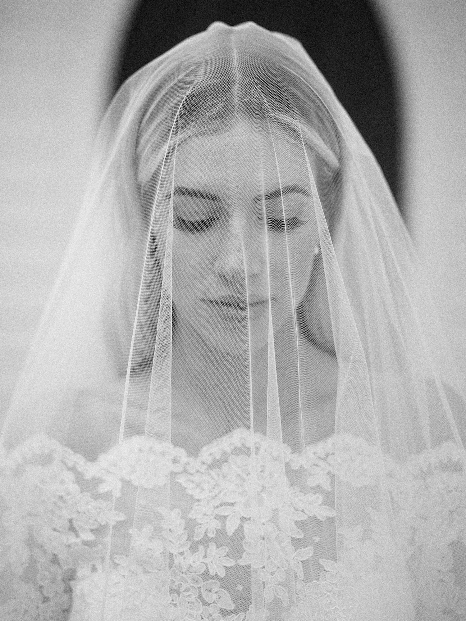 close-up of the bride with veil covering her face